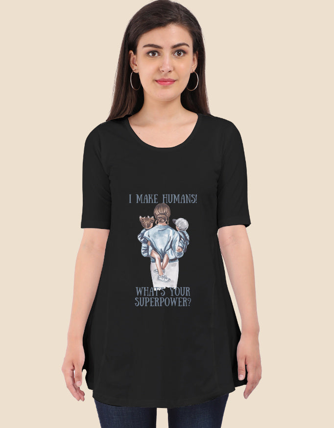 Woman wearing black I make humans maternity t-shirt